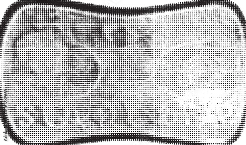 A textured dark grey rectangular object rests on a light surface.