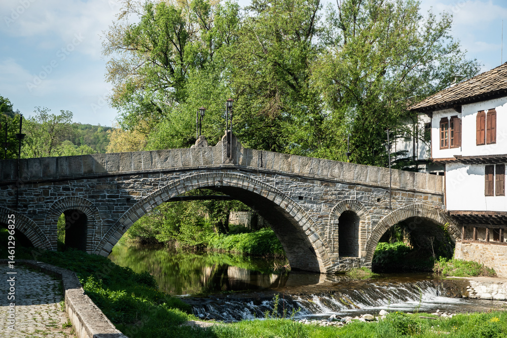 Old stone bridge over the river in the old town of Tryavna, Bulgaria Old stone bridge over the river in the old town of Tryavna, Bulgaria