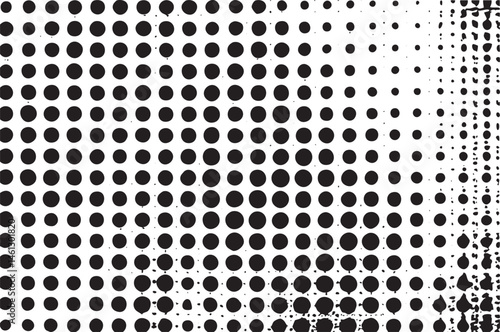 A dense of black and white circles gradually transitions into a lighter shade.
