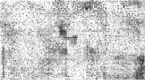 A dense grid of small scattered white dots covers a dark background.