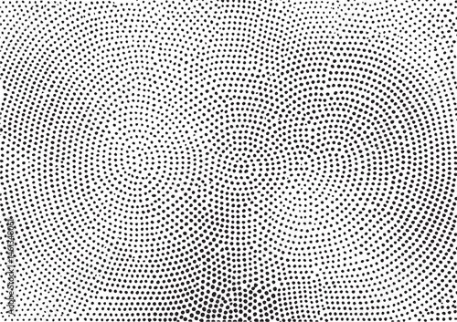 A monochrome portrait emerges from a dense field of scattered dots.