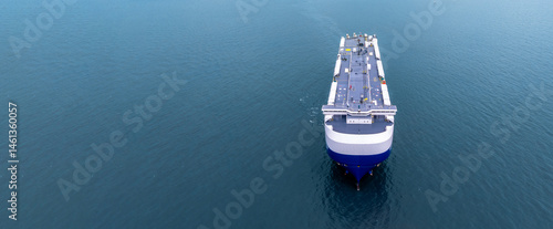 Obraz na płótnie Aerial view RoRo Ship business logistic and transportation sea freight, Cargo and RoRo ship Roll On Roll Off ship at sea, Car carrier ship RO-RO Roll on Roll off. w salonie