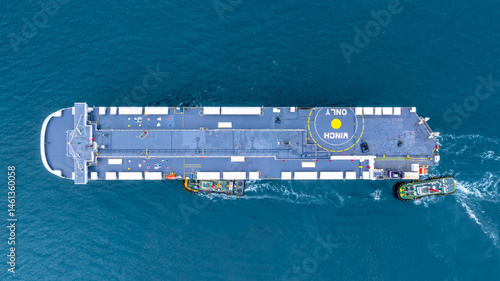 Obraz na płótnie Aerial view RoRo Ship business logistic and transportation sea freight, Cargo and RoRo ship Roll On Roll Off ship at sea, Car carrier ship RO-RO Roll on Roll off. w salonie