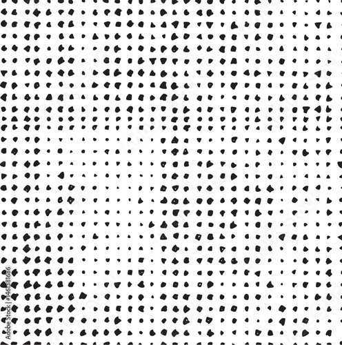 A dense of small irregular black and white dots creates a textured surface.