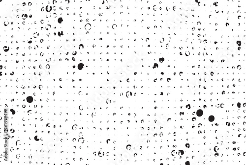 A dense scattering of dark circular shapes covers a white background.