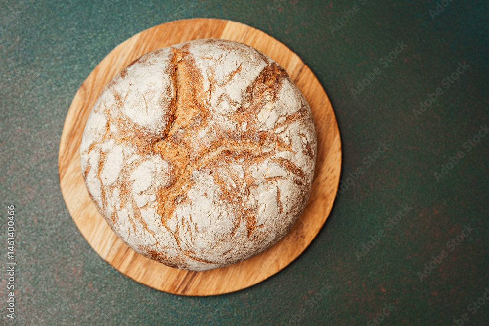 Freshly baked bread on a wooden board ready to be served