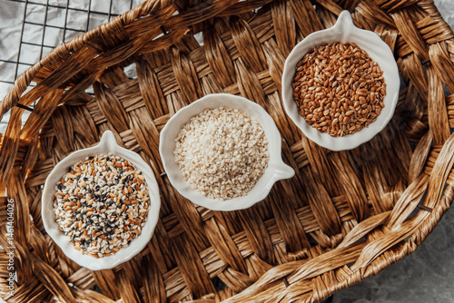 Obraz na płótnie Different types of seeds displayed in bowls on a woven tray w salonie