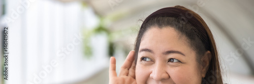 Happy Southeast Asian Indian woman hearing or listening with happy smiling positive mood, feeling good