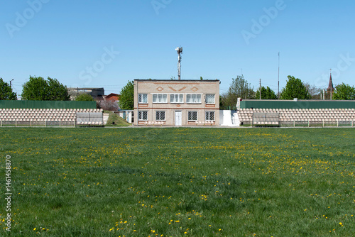 Tableau sur toile Football field of a stadium with uncut grass