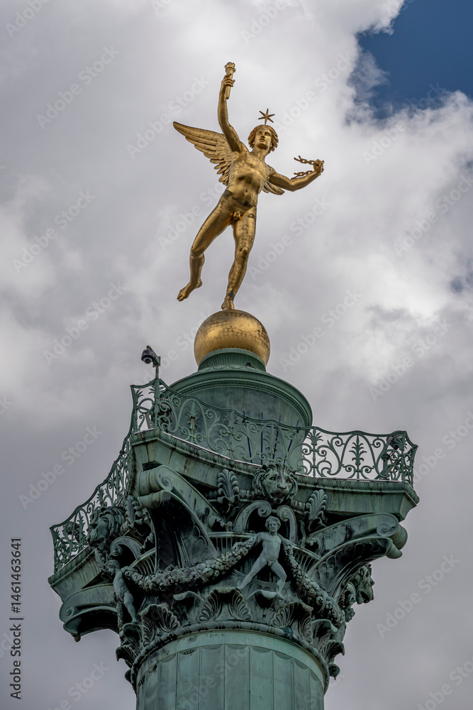 Fototapeta premium Paris, France - 05 03 2025: Place de la Bastille. Detail View of the genius of Liberty golden statue on July column.