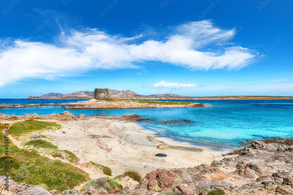 Unbelivable morning view of famous La Pelosa beach and rocky shore near Torre della Pelosa