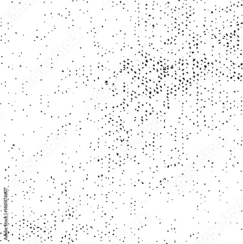 A dense scattering of tiny black dots covers a white background.
