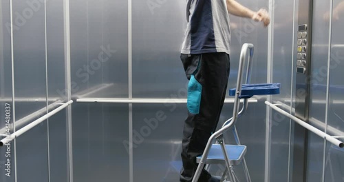 Elevator technician fixing the elevator