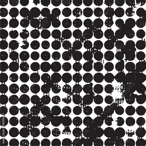 A dense arrangement of black and white circles dominates the