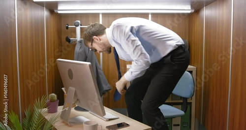 Panicked employee in a small claustrophobic office