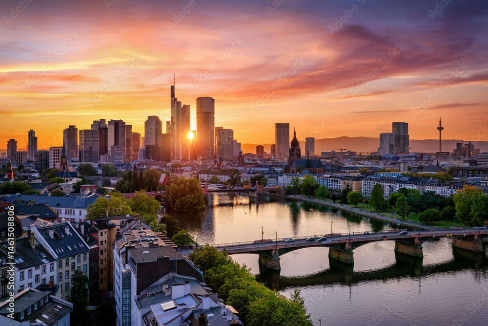 Panoramic view of the city skyline of Frankfurt am Main, Germany, during a beautiful summer sunset with colorful sky