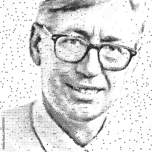 A man wearing glasses smiles warmly at the viewer.