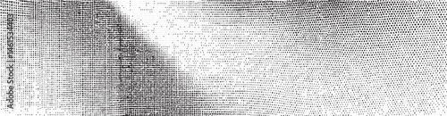 A textured monochromatic fabric stretches horizontally across the frame.