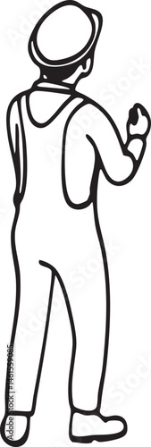 A worker stands with his back to the viewer holding a tablet.