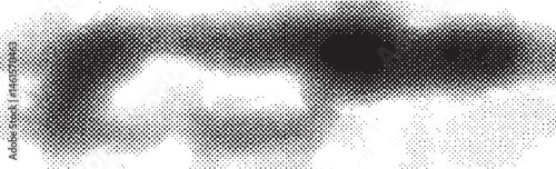 A grayscale depicts a blurred circular shape against a stark black background.