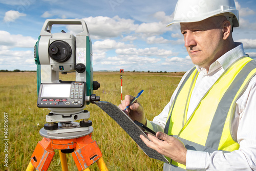Surveyor in safety gear use...