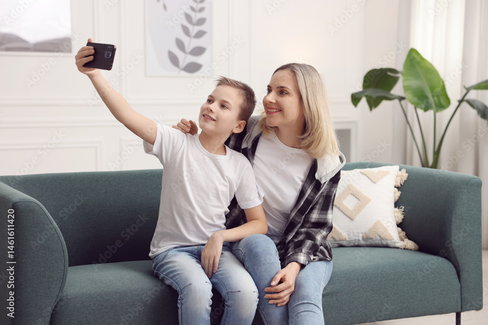 Mother and son taking selfie at home Mother and son taking selfie at home