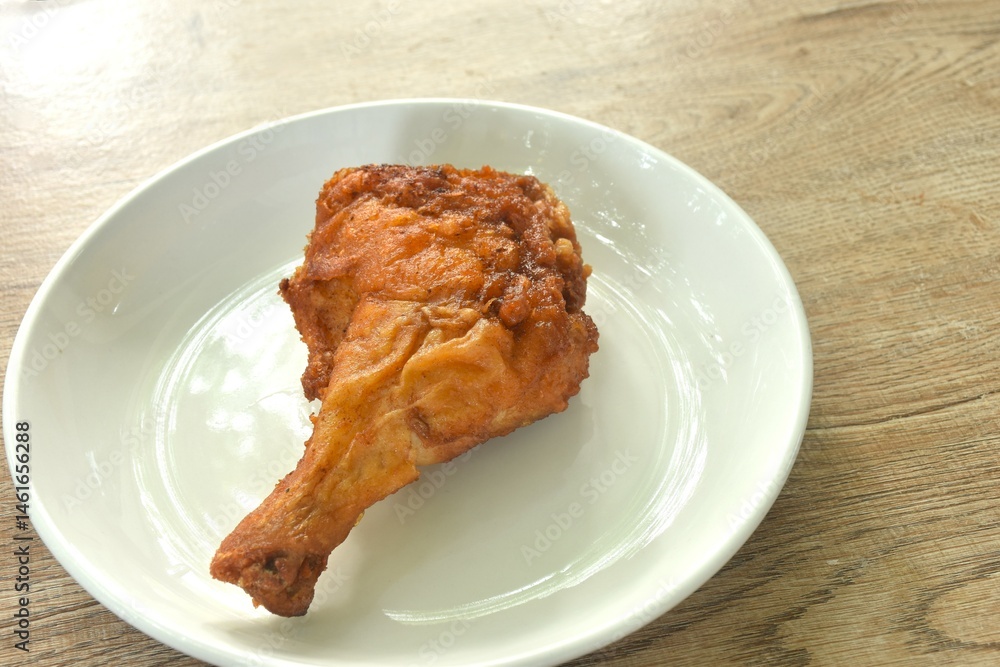 crispy fried chicken tight and leg fermenting with herb on plate