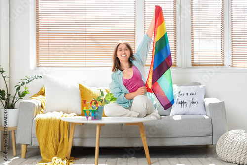 Young woman with LGBT flag ...