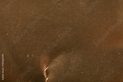 High-resolution image of a scratched gold metal texture. Perfect for backgrounds and design projects.