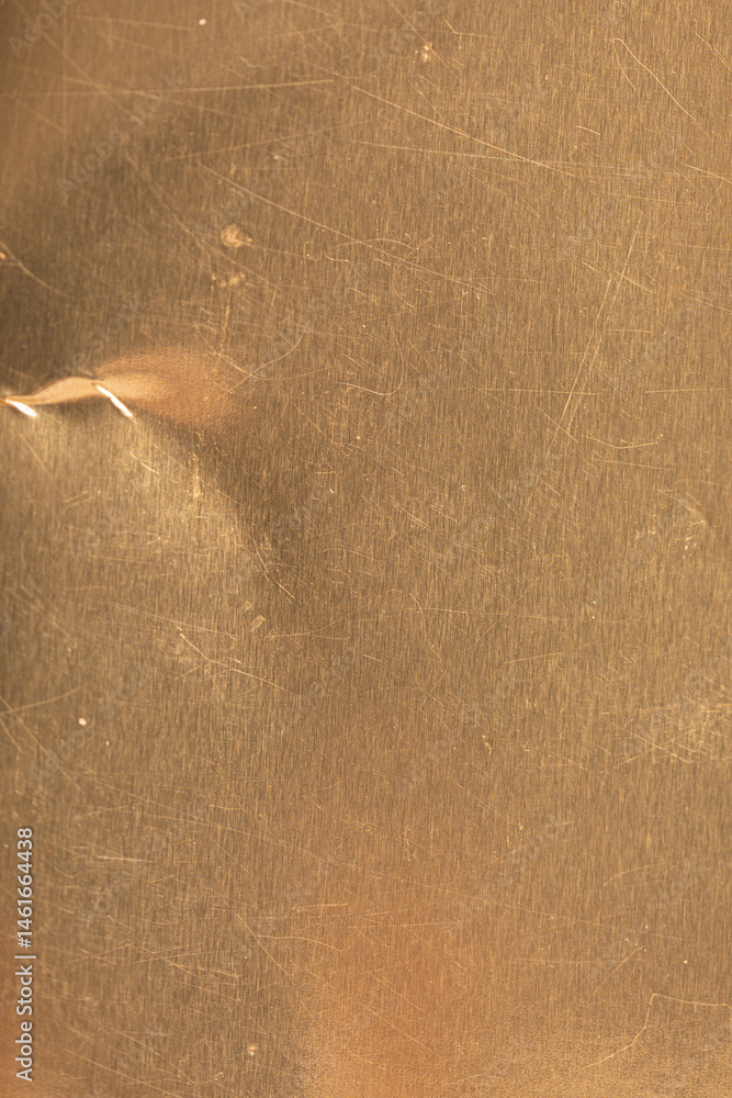 High-resolution image of a scratched gold metal texture. Perfect for backgrounds and design projects.