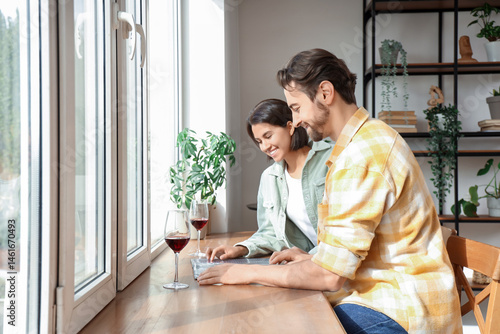 Young couple reading menu i...
