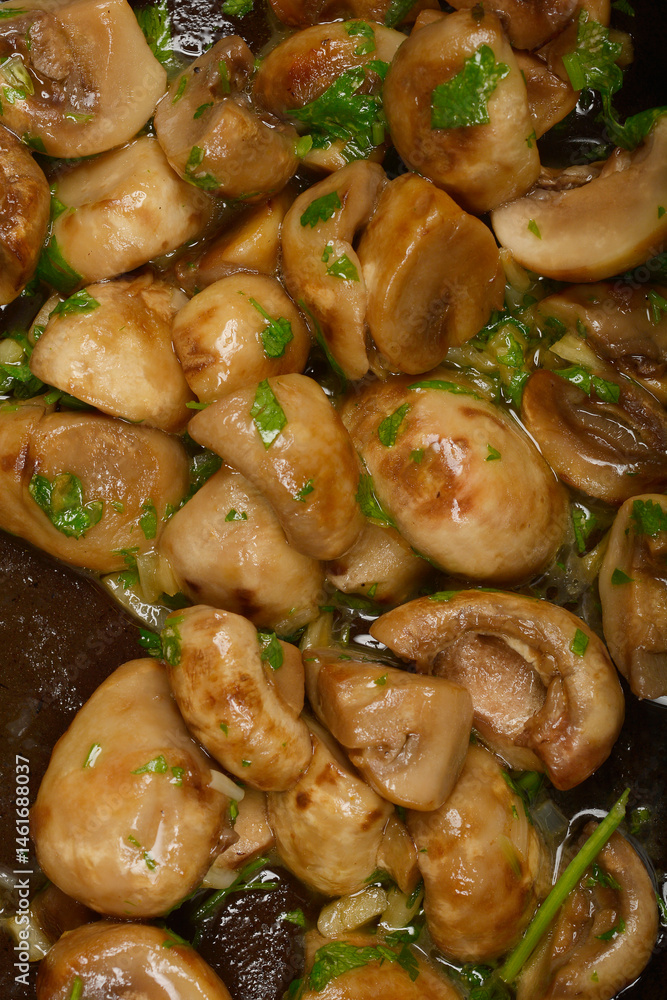 A close-up shot shows sauteed mushrooms glistening with sauce and sprinkled with fresh herb