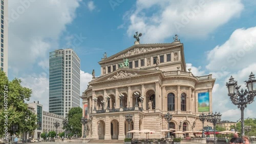 Hyperlapse of the Alte Oper (Old Opera) house in Frankfurt, a concert hall in Opernplatz. The square features a central fountain with people walking around, highlighting historic landmark timelapse