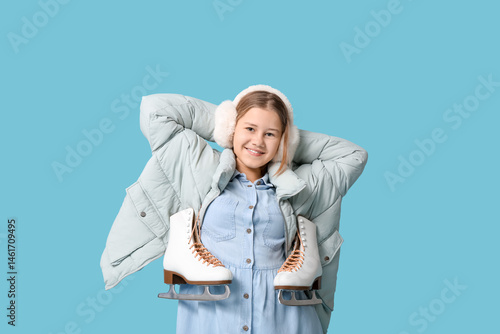 Happy girl with ice skates ...