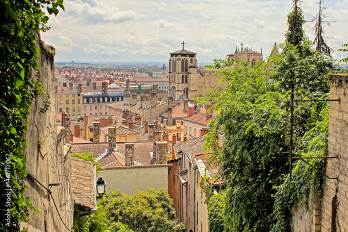 Fototapeta Naklejka Na Ścianę i Meble -  High angle view on the historical center of the the city of Lyon, France, on a cloudy summerday 