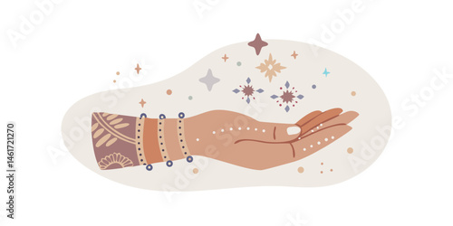 Hand with bracelets holding sparkles in boho magical style