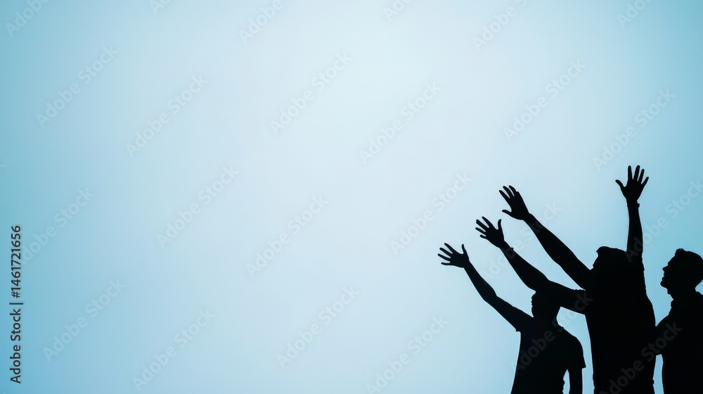 Silhouettes of people reaching upward against a clear blue sky, symbolizing hope, aspiration, and unity.