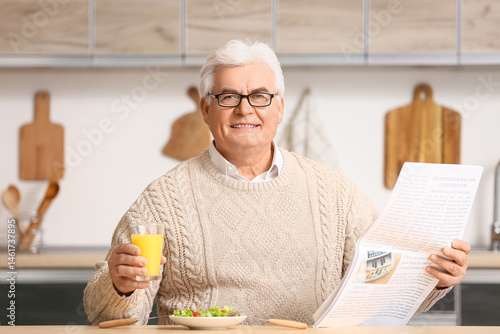 Handsome senior man reading...