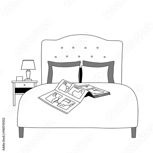 Bed with opened magazine on white bedding in a minimalist room
