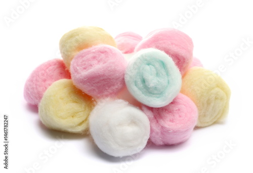 colorful cosmetic cotton balls isolated on white background, side view