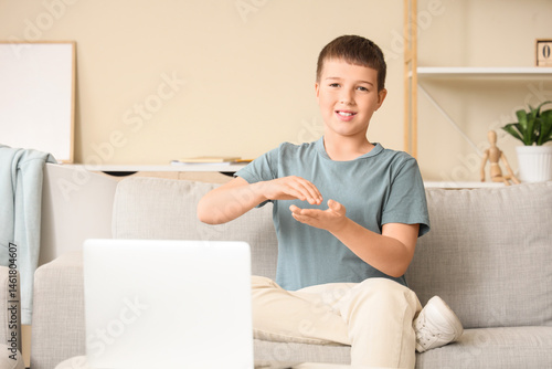Mute boy using sign languag...
