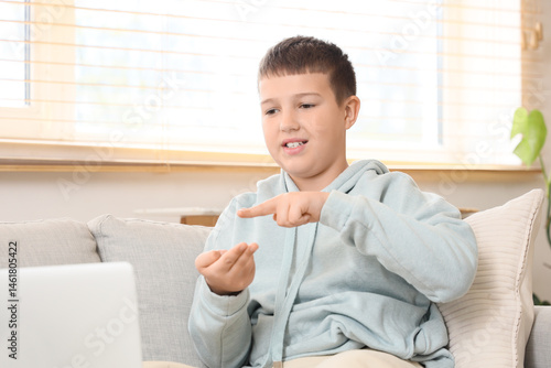 Mute boy using sign languag...