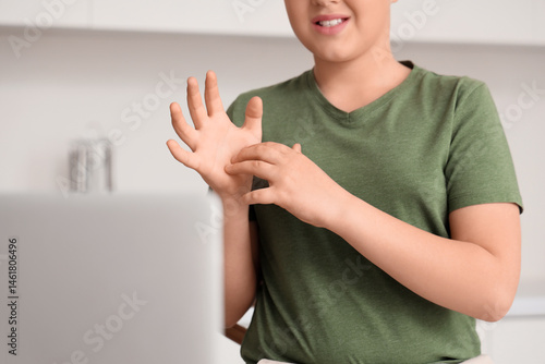 Mute boy using sign languag...