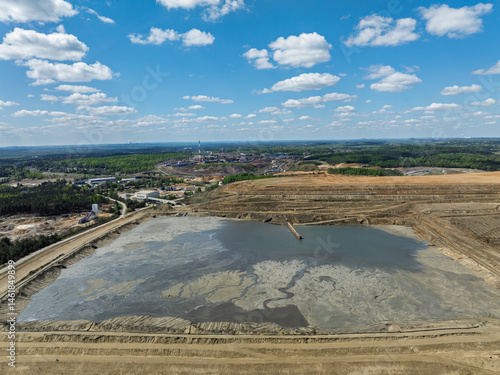 Obraz na płótnie Industrial coal mine, abstract sendimentation tank of mine in Poland. Industrial lake Aerial drone photo view. Settling tanks and clarifiers are on wastewater treatment plant w salonie