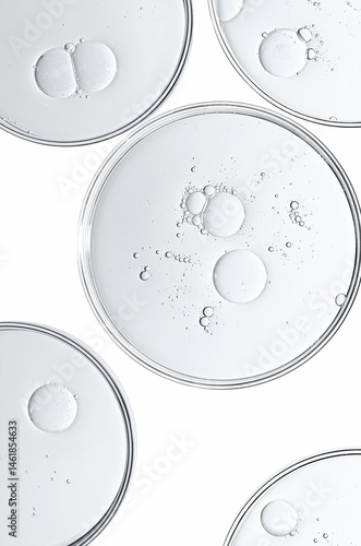 The texture of a cosmetic serum or body gel in a Petri dish.