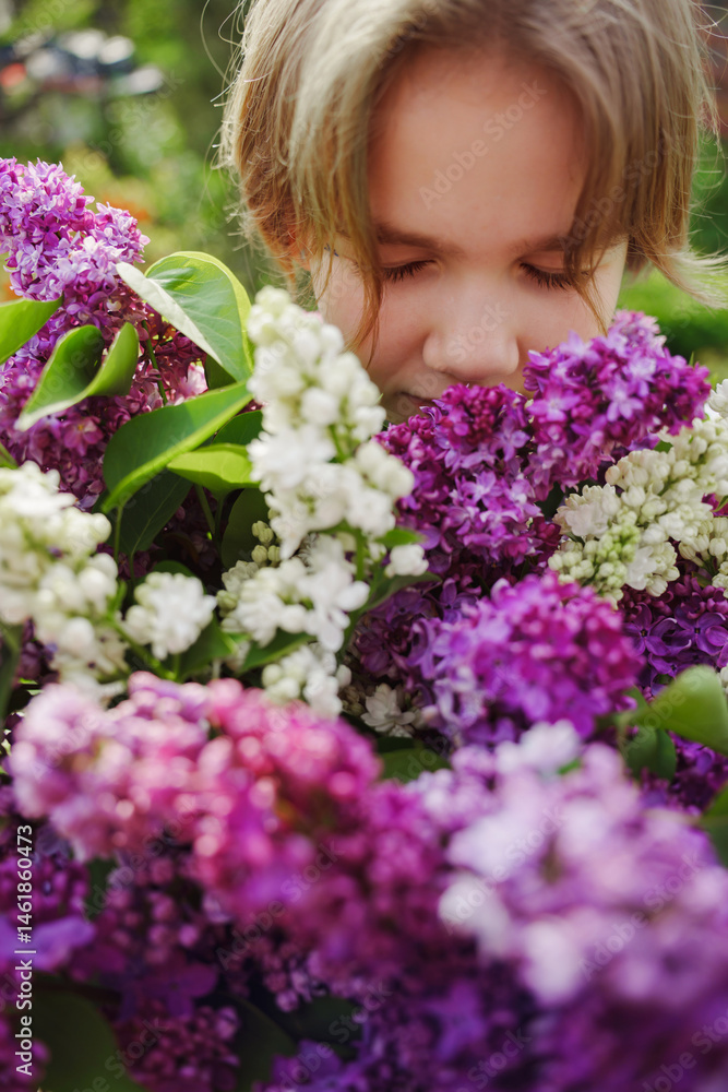 Child admires fragrant lilacs while enjoying a sunny spring day outdoors