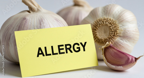 Garlic Allergy Close up of Two Bulbs and Yellow Note photo