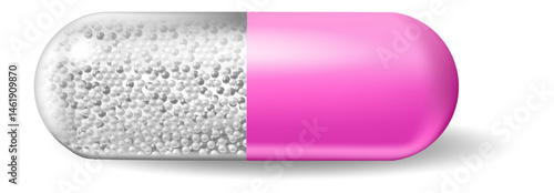 Pink and silver medicine capsule, filled with numerous small white spherical granules, rests on a white background, casting a soft shadow that highlights its detailed design