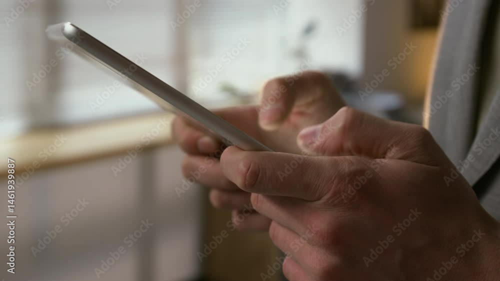 Extreme close-up shot of hands of unrecognisable businessman replying to clients messages using digital tablet Extreme close-up shot of hands of unrecognisable businessman replying to clients messages using digital tablet