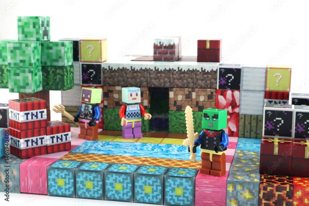 Naklejka premium minecraft magnetic building toy blocks , from online virtual world game series are display on white table with many kinds of minecraft blocks , tnt magma stone wood grass water and cute characters